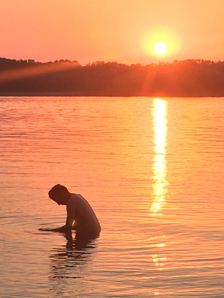 Cristi bathing at sunset