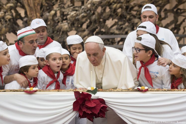 This handout picture released by the Vatican press office shows Pope Francis blowing a candle on a pizza on December 17, 2017 during an audience with children assisted by "Dispensario Santa Marta", a Vatican pediatric clinic at the Vatican. Pope Francis celebrates his 81st birthday today on December 17, 2017. / AFP PHOTO / OSSERVATORE ROMANO AND AFP PHOTO / HO / RESTRICTED TO EDITORIAL USE - MANDATORY CREDIT "AFP PHOTO / OSSERVATORE ROMANO" - NO MARKETING NO ADVERTISING CAMPAIGNS - DISTRIBUTED AS A SERVICE TO CLIENTS HO/AFP/Getty Images